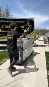 stark-moving-services-furniture-delivery-truck Professional crew providing Moving Company in Angus, ON services during a residential relocation